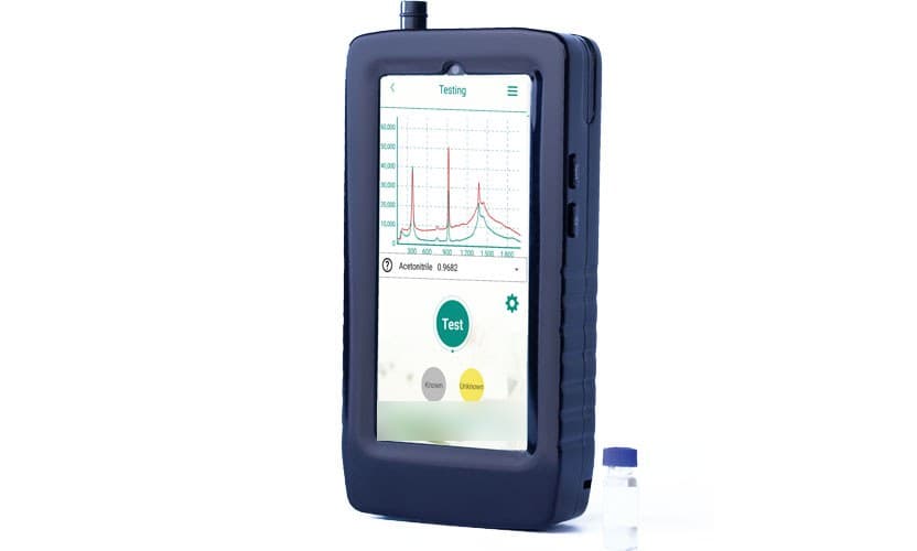 Finder Edge handheld Raman spectrometer next to a sample vial